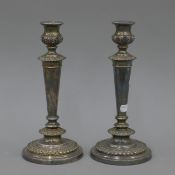 A pair of silver plated candlesticks.