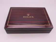 A vacant Rolex box. 18 x 12.5 cm.