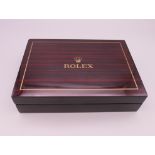 A vacant Rolex box. 18 x 12.5 cm.