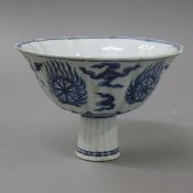 A Chinese blue and white porcelain stem cup. 15.5 cm diameter.