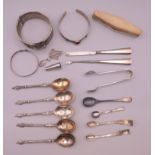 A quantity of silver items, including bracelets, sugar tongs, five Apostle spoons, etc.