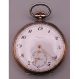 A Longines silver pocket watch. 5 cm diameter.