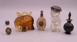 Five vintage perfume bottles. Elephant form bottle 5.5 cm high.