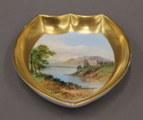 A Coalport porcelain shaped dish painted with a castle. 11 cm wide.