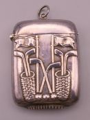 A sterling silver vesta decorated with golf clubs. 5 x 3.5 cm.