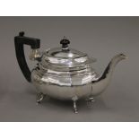 A silver teapot. 29 cm long. 18.3 troy ounces total weight.