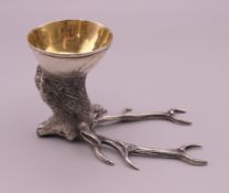 A silver deer head form stirrup cup, bearing Russian marks. 7 cm high. 105.8 grammes.