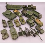 A quantity of various die cast military vehicles and cannons, including Dinky and Matchbox.