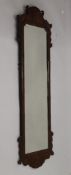 A 19th century mahogany wall glass. 130 cm high.