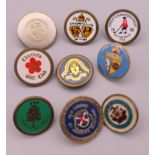 Nine golfing lapel badges. Largest 2 cm diameter.