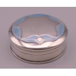 A silver and blue enamel pill box. 3.25 cm diameter.