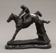 A bronze of a horse and jockey. 35 cm long.