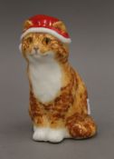 A Winstanley pottery model of a Christmas cat. 16 cm high.