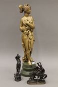 A painted plaster statue of a classical maiden; together with two 19th century spelter figures,