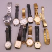 A quantity of wristwatches in a wooden box, including Longines, Seiko, Casio, Tissot, etc.