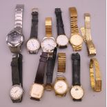 A quantity of wristwatches in a wooden box, including Longines, Seiko, Casio, Tissot, etc.