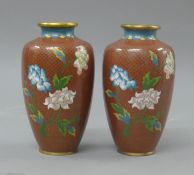 A pair of red cloisonne vases. 18 cm high.