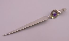 A silver and amethyst paper knife. 18 cm long.