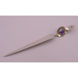 A silver and amethyst paper knife. 18 cm long.