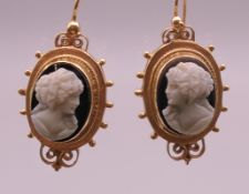 A pair of 14 K gold hardstone cameo earrings. 3 cm high. 10 grammes total weight.