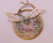 An Art Nouveau dragonfly form pendant. 9 cm wide across wings.