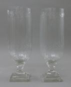 A pair of cut glass storm lamps. 34 cm high.