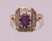 A 9 ct gold amethyst and diamond ring. Ring size P. 3.6 grammes total weight.