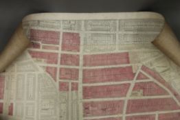 A rolled London Insurance Plan, partly coloured laid down on canvas by Edward Stanford,