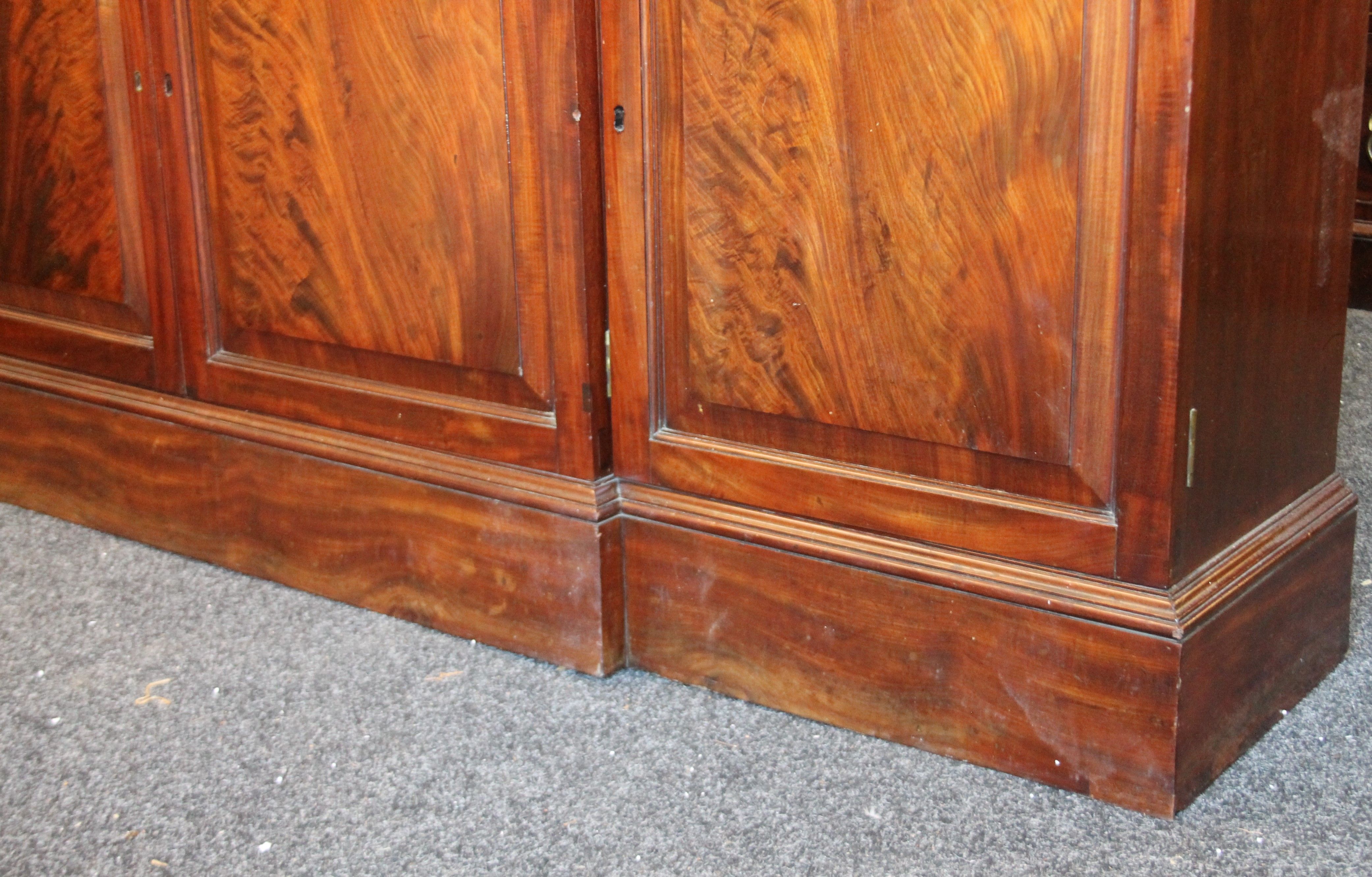 A near pair of early 19th century and later mahogany breakfront bookcases (one probably made to - Image 12 of 18