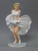 A cast iron model of Marilyn Monroe. 33 cm high.
