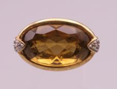 A silver gilt and topaz ring. Ring size N/O.