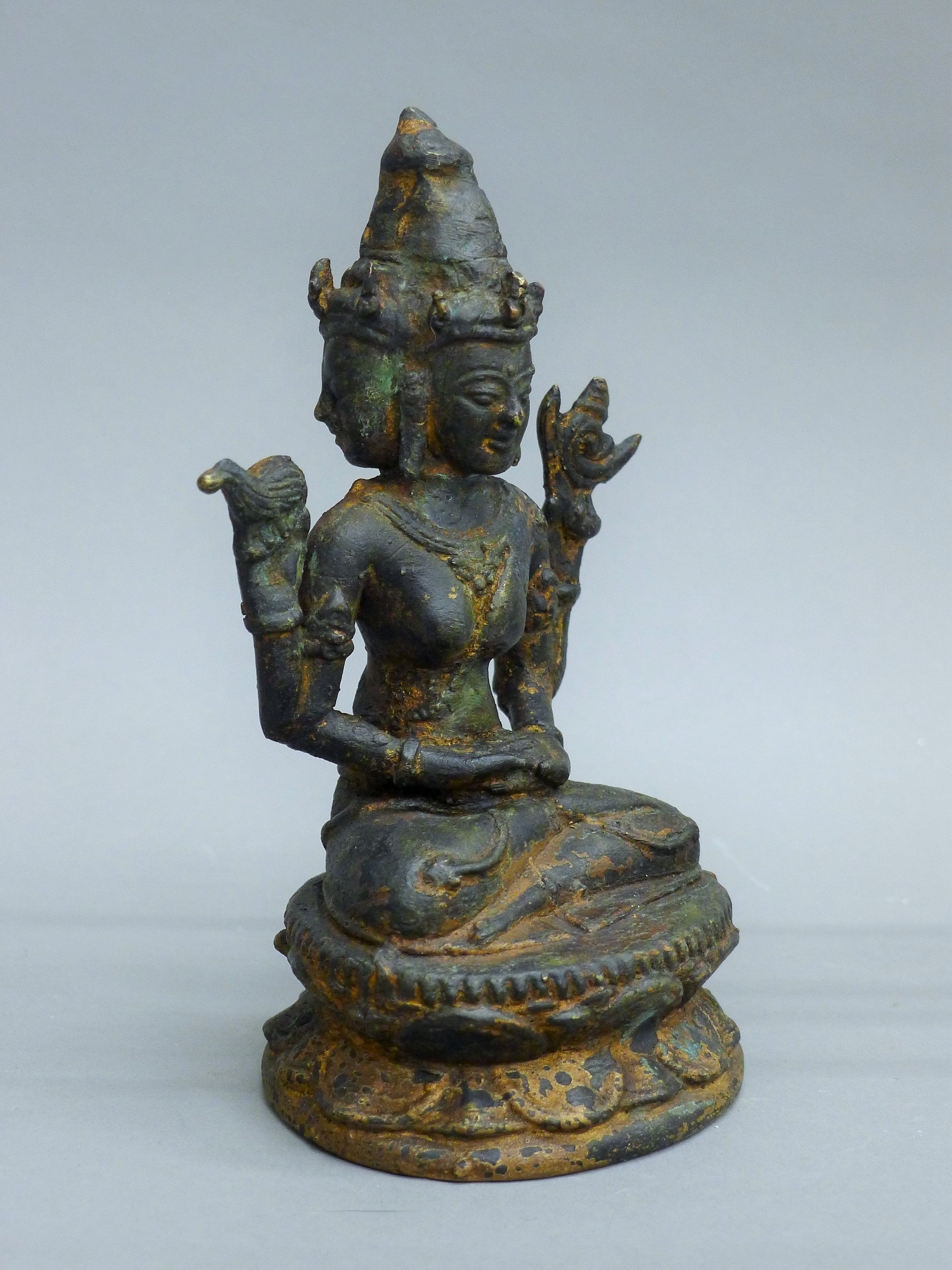 A bronze figure, possibly Ushnishavijaya, seated on a double lotus base. 15.5 cm high. - Image 2 of 5