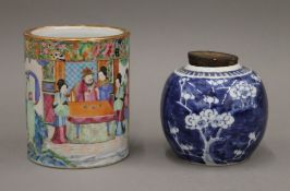 A 19th century Canton brush pot and a ginger jar. The former 15.5 cm high.