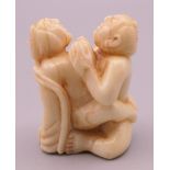 A erotic bone netsuke. 4 cm high.