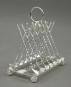 A silver plated golf club form toast rack. 16 cm long.