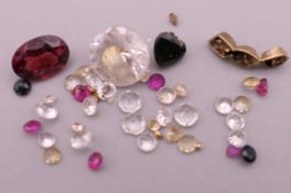 A quantity of loose gemstones, diamonds, sapphires, etc.