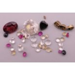 A quantity of loose gemstones, diamonds, sapphires, etc.