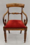 A Victorian mahogany open armchair. 53 cm wide.