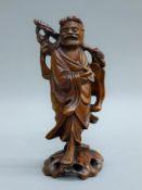 A wood carving of Shou Lao and a wood carving of Buddha. The former 20.5 cm high.