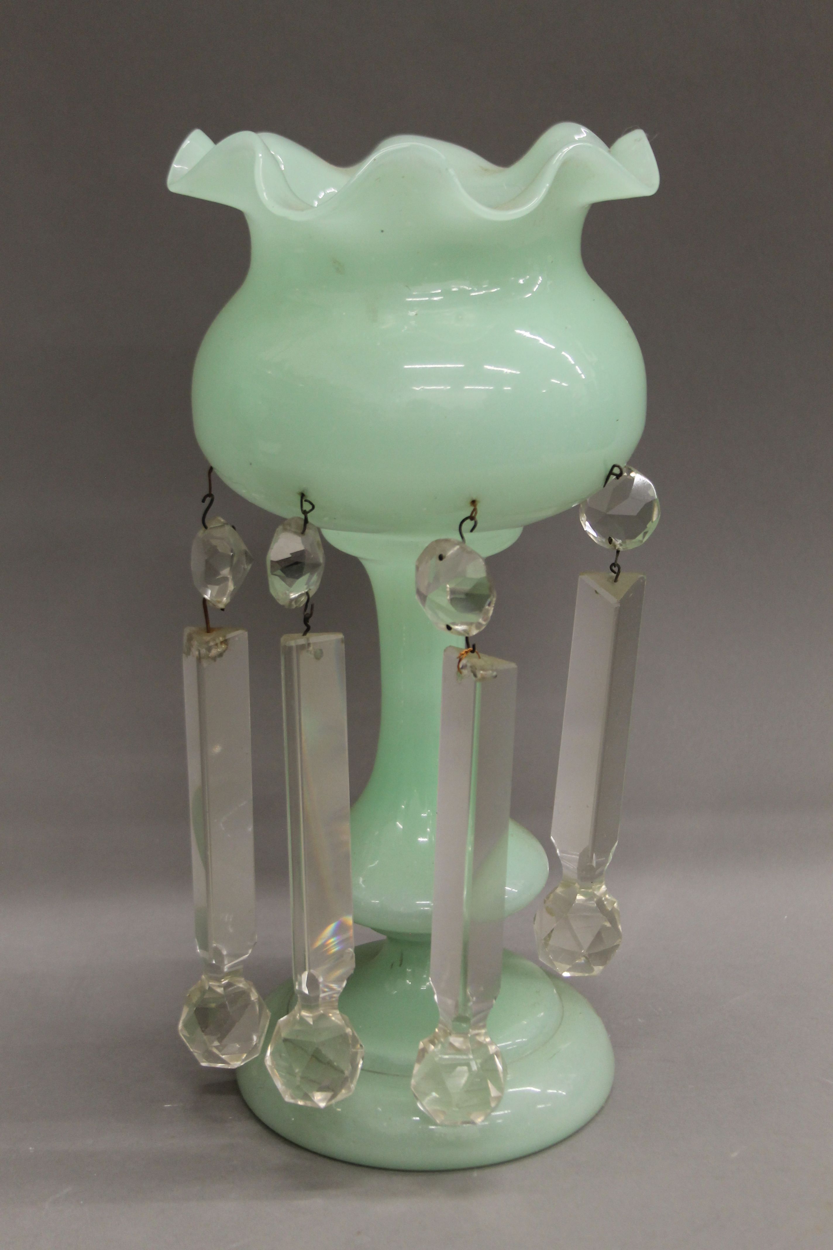 A pair of Victorian green glass lustres. 33 cm high. - Image 2 of 3