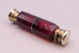 A Victorian double ended ruby glass scent bottle. 13.5 cm long.