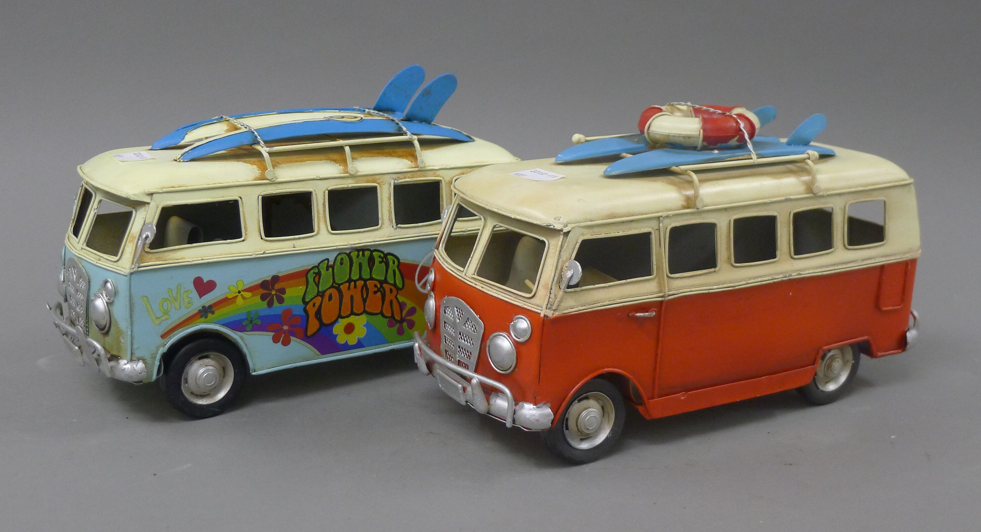 Two tin models of VW camper vans. 23 cm long.