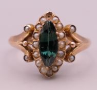 A Victorian 9 ct gold, seed pearl and sapphire marquise ring. Ring size N/O. 1.