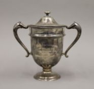 A silver twin handled trophy,