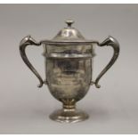 A silver twin handled trophy,