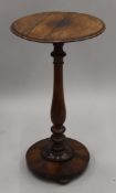 A rosewood tripod table. 71.5 cm high.