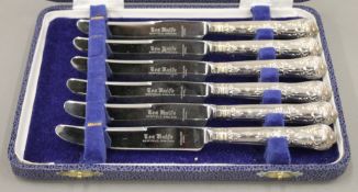 A cased set of six silver handled tea knives.