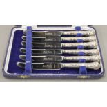 A cased set of six silver handled tea knives.