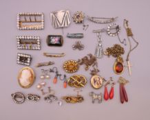 A box of miscellaneous jewellery, including buckles, brooches, earrings, etc.