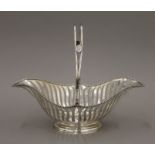 A silver basket. 29.5 cm long. 16.3 troy ounces.